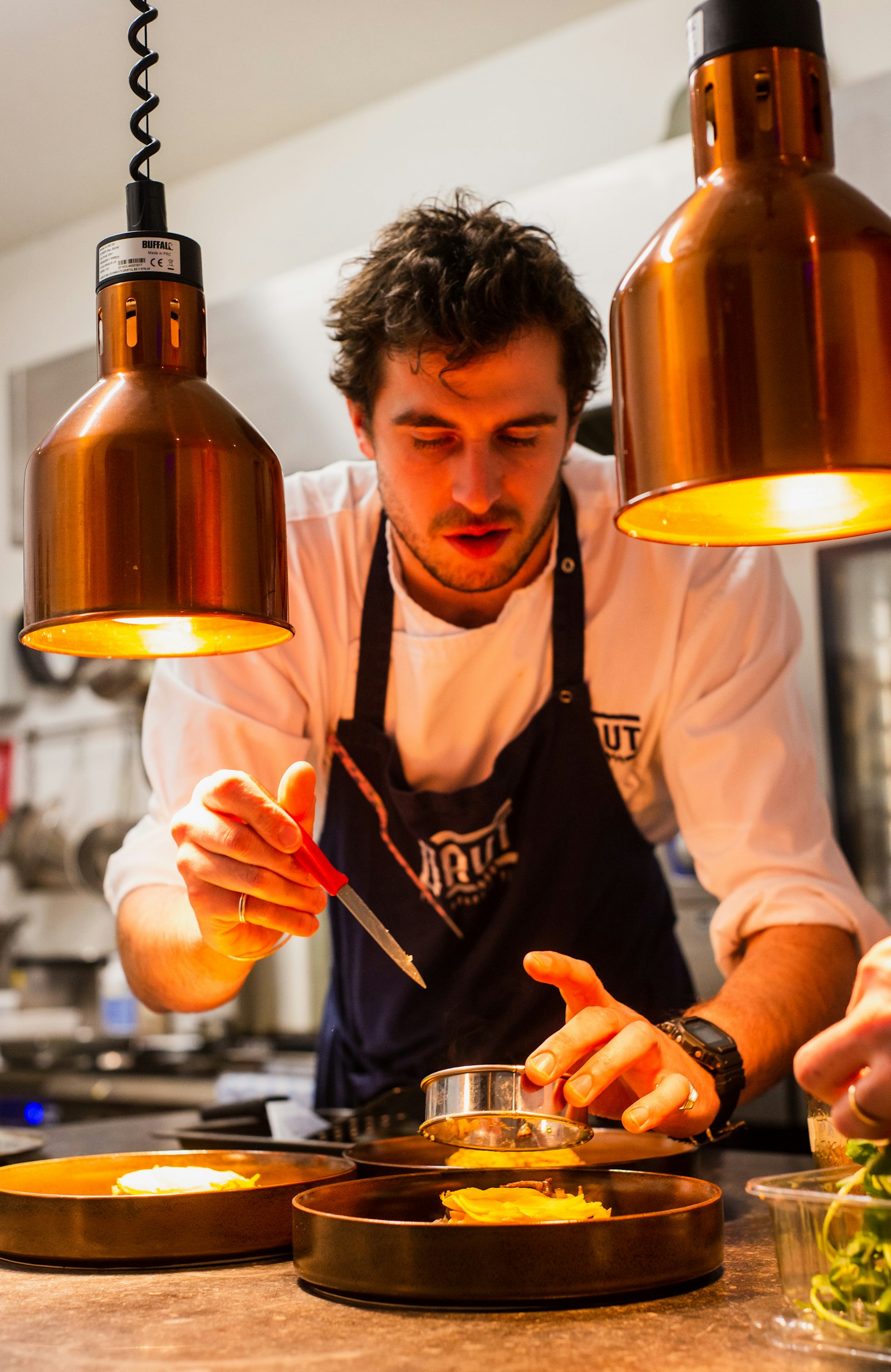 A chef working with food in the kitchen