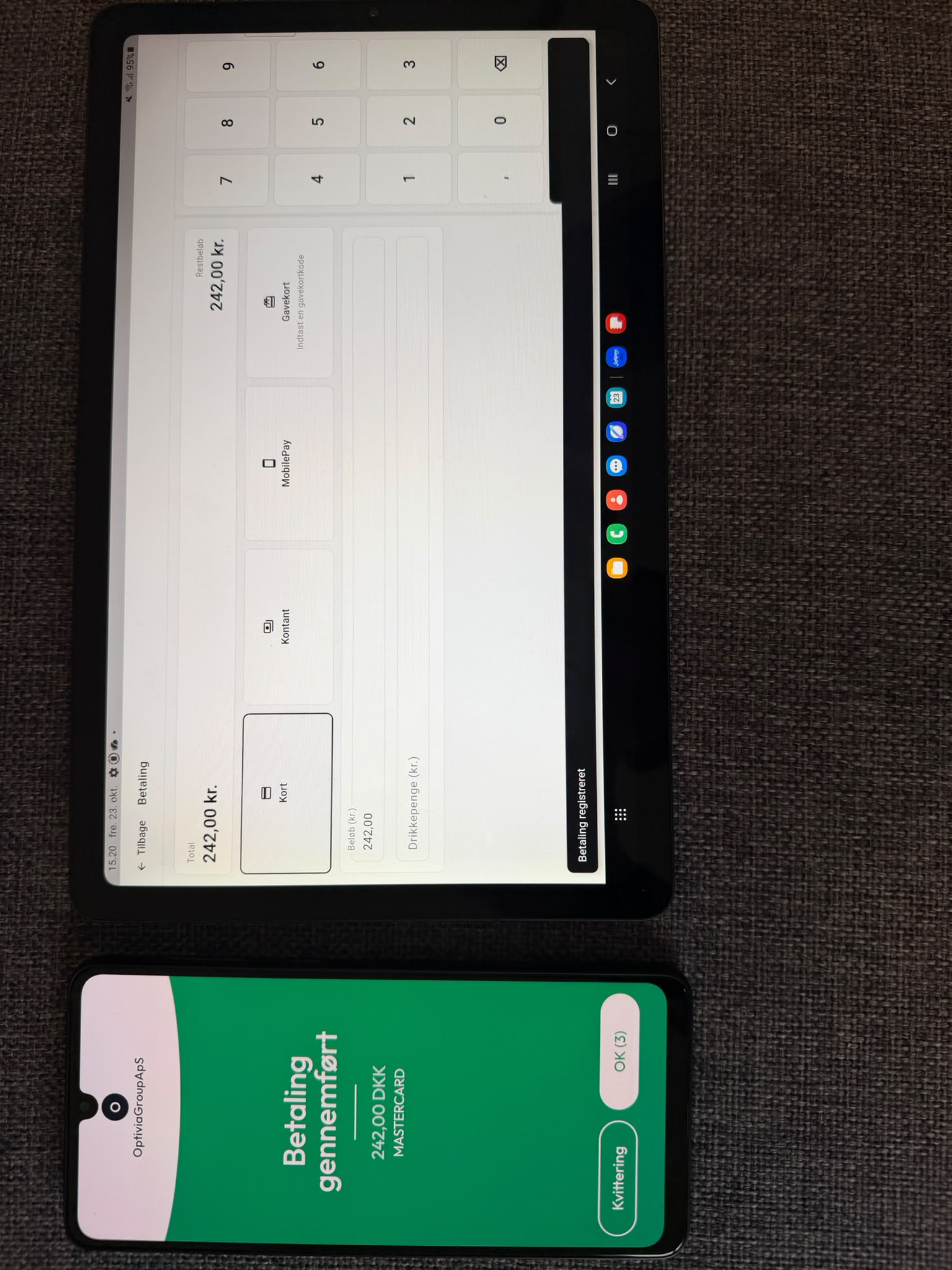 DishiPOS on a tablet and a completed Softpay payment on a phone